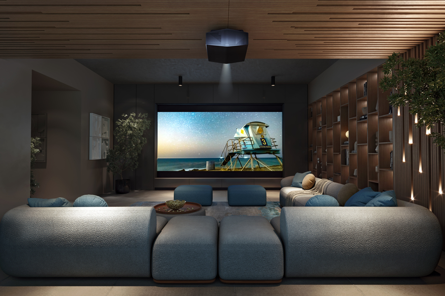 Dark modern home theater with large screen showing football game