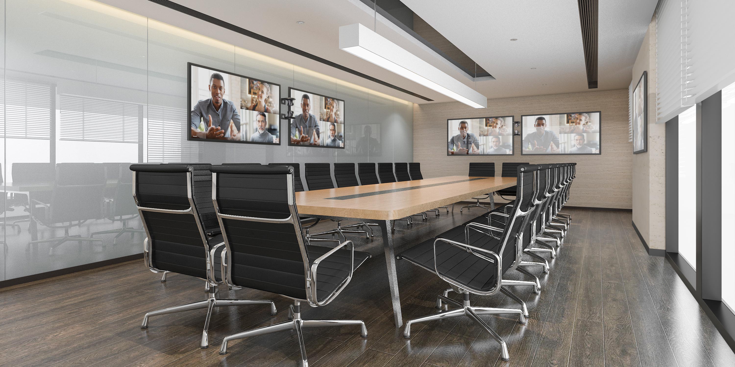 Large boardroom with black chairs and video conference screens