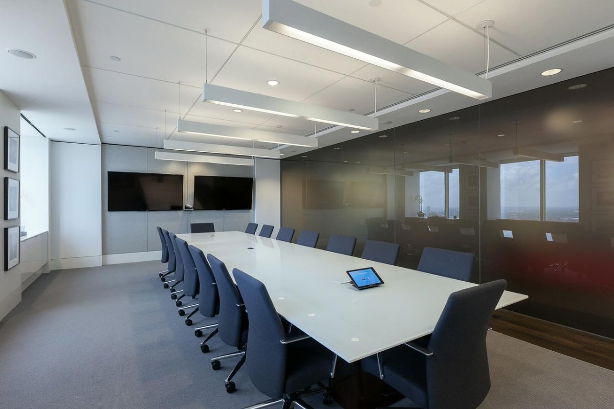 Executive meeting room with wall-mounted screens and city view