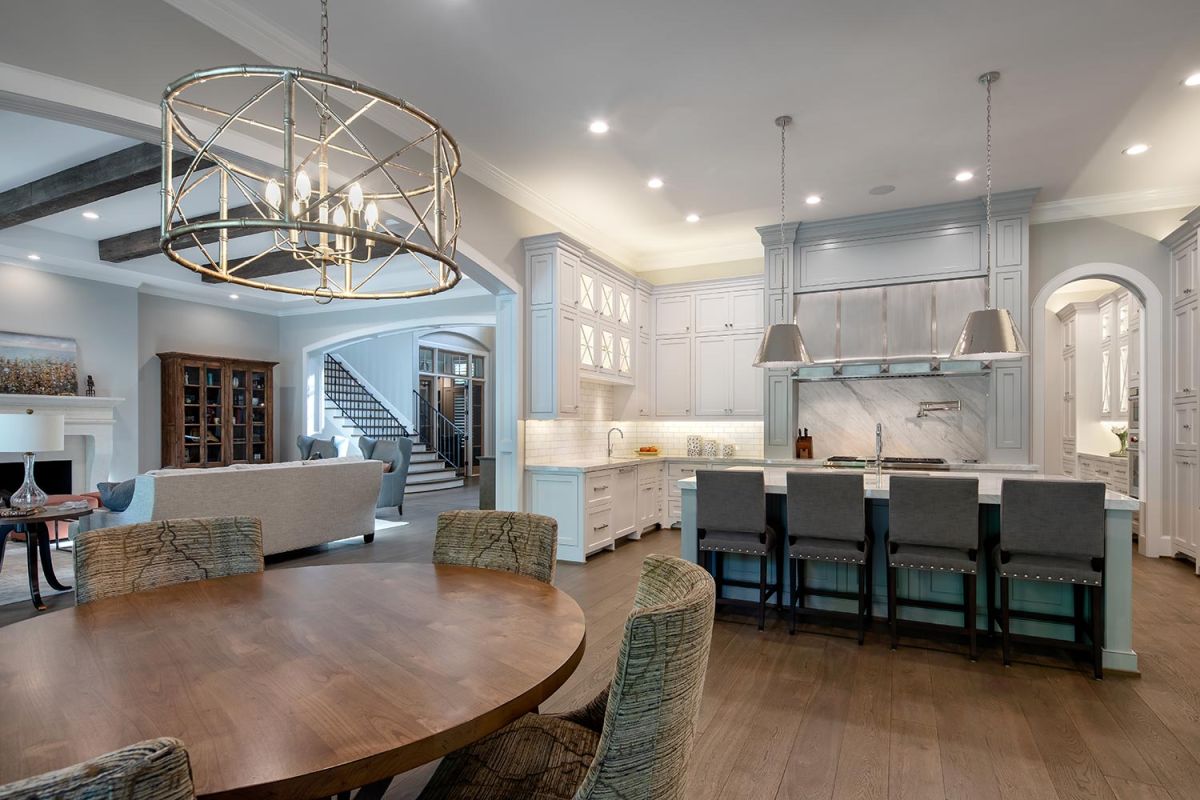 Open kitchen and dining area with large island and pendant lights